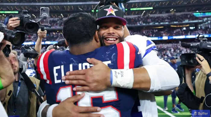 Elliott shares a post game hug with former Dallas Cowboys teammate Dak Prescott